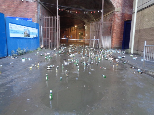 Bottles in the mud on Little Neville Street (taken Dec 27 2015).