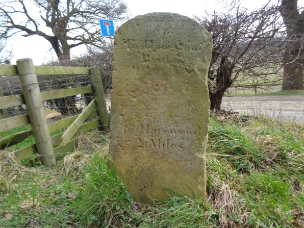 Stone pillar with direction/mileage to Harewood at the junction of Eccup Lane and Weardley Lane, Leeds (taken on Leap Year Day Feb 29 2016).