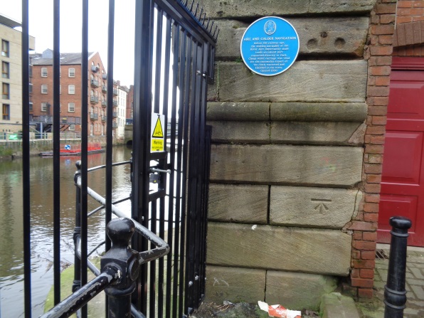 Photo taken on March 8 2016 of the Bench Mark and the Blue Plaque on Riverside Court (off The Calls).