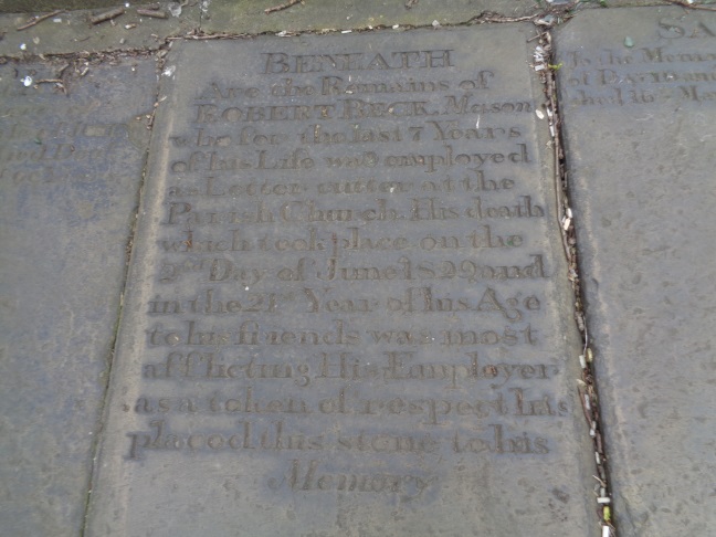 A gravestone used as one of the paving stones in the small park by York Street, Leeds (photo taken on March 15 2016).