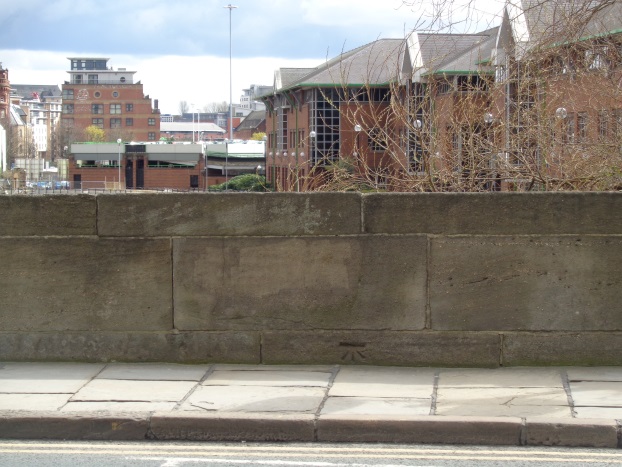 Location view (looking down river) of the old Bench Mark on Victoria Bridge, Leeds (taken April 7 2016).